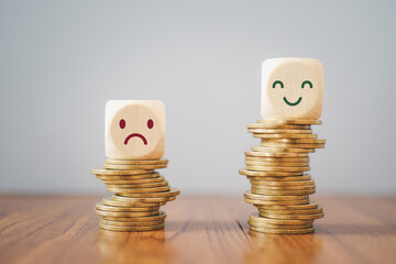 emotion face on  stack of coins, saving money, deposit, wealthy, profit, cash for health budget or...