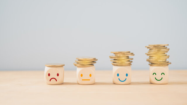 emotion face on  stack of coins, saving money, deposit, wealthy, profit, cash for health budget or insurance concept