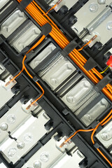 Electric car lithium battery pack and wiring connections internal between cells on background. Lithium-ion battery technology in EV car