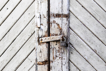 Wooden door with padlock white