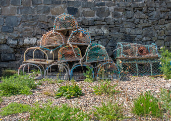 Lobster and crab pots piled against a wall