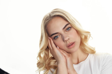 Fototapeta premium pretty blonde holding her head posing face close up