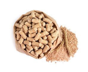Granulated wheat bran in bag and spikelets on white background, top view