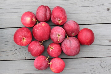red apples on a wooden background