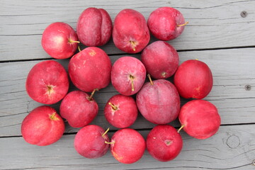 red apples on wooden background