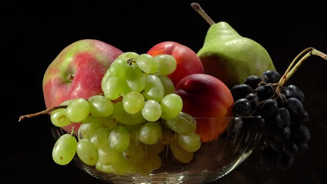 Still life with fruits. Grapes, nectarines, pears and plums.