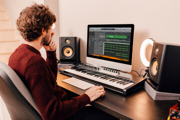 Music producer working at home music studio
