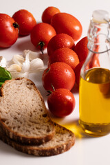 Fresh ingredients for making bruschetta on white background