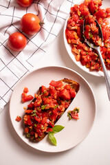Italian starter bruschetta with fresh tomatoes, olive oil, garlic and basil