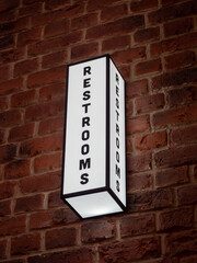 luminous sign that says restroom