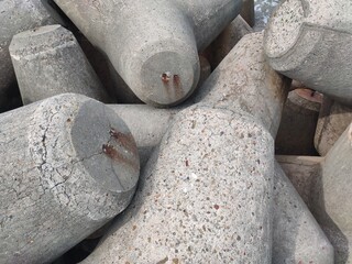 detail Stone breakwater on the beach