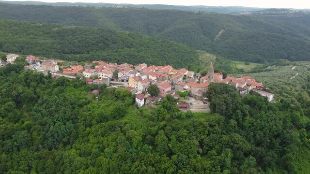 Aerial view of typical old Istrian village Padna on a hill in summer, Slovenia
