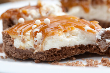 tartlet with milk cheese filling and lots of salted caramel with nuts