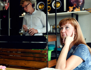 Caucasian woman sitting in a bar