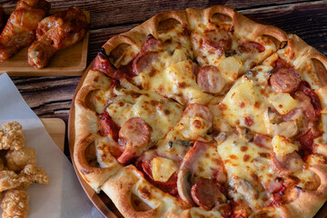 Closed up delicious pizza meat deluxe and sausage, traditional Italian food