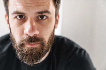 Smiling young brunette white man in sportswear