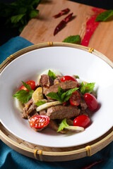 Food concept Thai spicy beef salad Yum Nua yang on wooden board with copy space