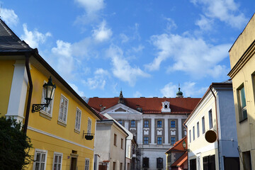 Fototapeta na wymiar Historic center of Kutna Hora. Old beautiful buildings in the sunny day. Central Bohemian Region, Czech Republic.