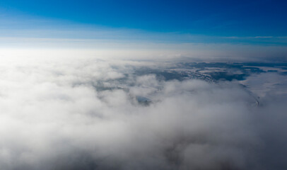 Naklejka na ściany i meble Amazing aerial shot of clouds in the sky