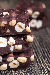 milk chocolate with whole and chunks of hazelnuts
