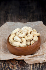 pile of cashew nuts on the table and in a wooden plate while eating
