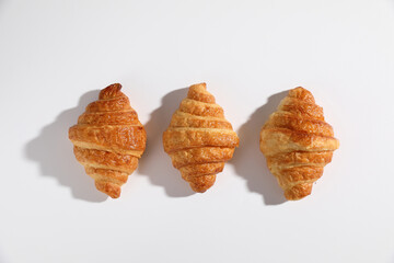 Croissant isolated in  wihite background with sunny light