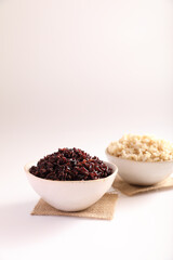 Fototapeta na wymiar Organic boiled brown rice on bowl isolated in white background