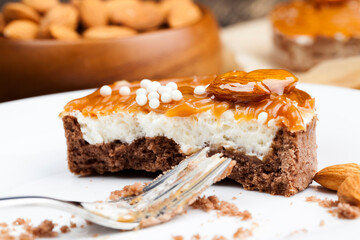 tartlet with milk cheese filling and lots of salted caramel with nuts