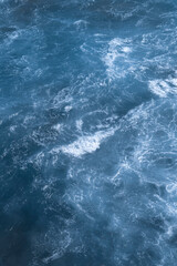Fototapeta na wymiar Aerial view of the ocean waves. Blue water background abstract texture