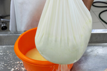 phases of ricotta production in a cheese factory in Greece