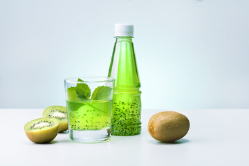 Fresh kiwi juice in glass with mint.