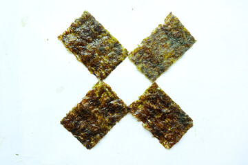 nori seaweed isolated on white background. Japanese food nori. Dry seaweed sheets. 
