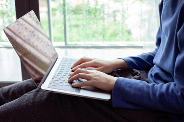Closeup man working remotely at home, Man typing on laptop or computer