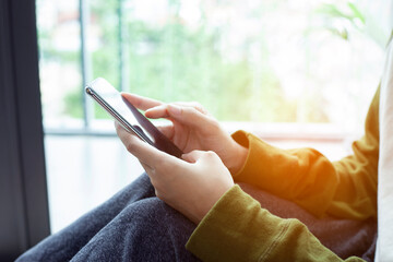 Closeup woman hand touch screen on smart phone, marketing technology and business concept.