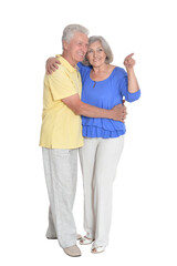 portrait of  senior couple pointing something