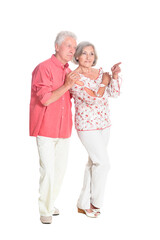 portrait of  senior couple pointing