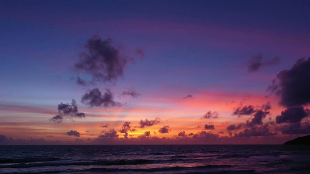 scenery sunset above the ocean clouds cover the ocean during colorful .cloud in sunset on Karon beach Phuket Thailand. .video 4K. Scene of Colorful red light in the sky background.