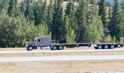 Heavy cargo on the road. A truck hauling freight along a highway
