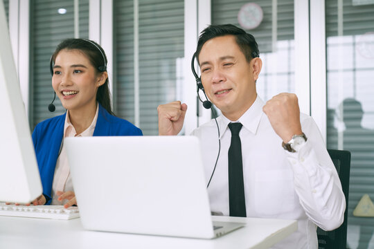 Asian Male Call Center Use Sign Language To Support Customer In Laptop And Team Suport By Voice