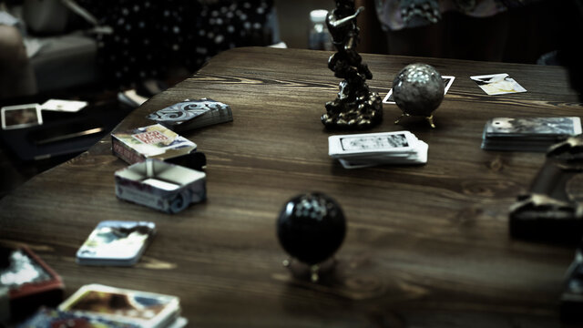Blurred Tarot cards on the table, esoteric concept, fortune telling and predictions