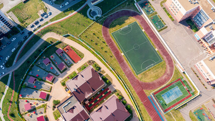  Community sports grounds for team games, basketball, football, volleyball, handball in a residential area, aerial view