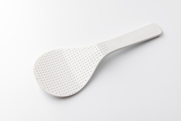 plastic rice paddle on a white background