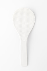 plastic rice paddle on a white background