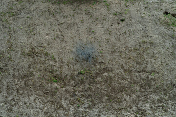 Background with dirty ground. Top view of the surface with wet sand and soil