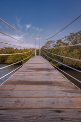 Obraz premium suspension bridge over the river