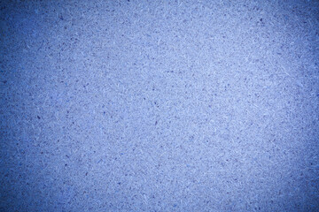 Texture blue recycled compressed wood chippings board background.