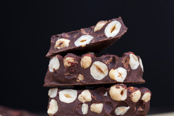 milk chocolate with whole and chunks of hazelnuts