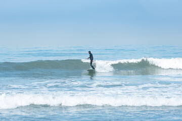 surfer in action surfing the wave