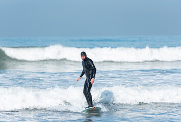 man surfing on the beach