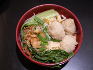 Meatball dish Indonesian food served on a red bowl looks very delicious